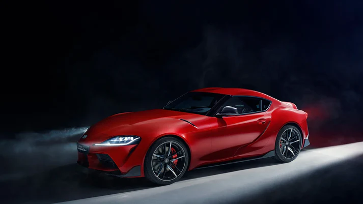 Stunning black automotive wall art featuring a sleek red sports car in a dramatic setting.