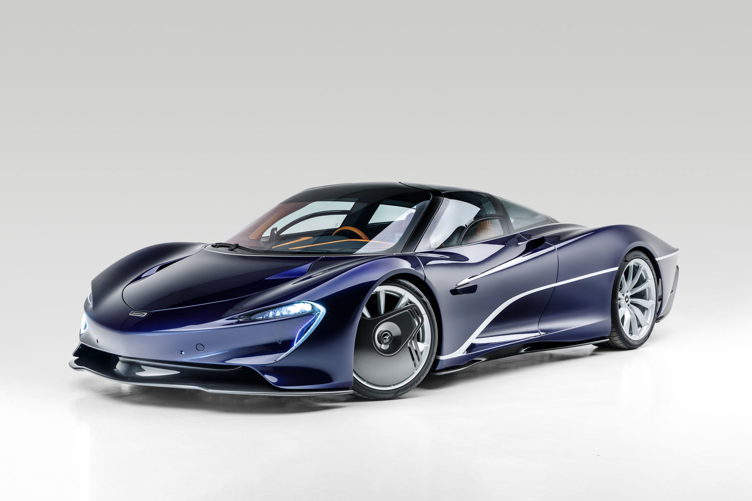 Studio Series Wall Art UAE - high-contrast studio lighting showcasing a sleek blue sports car.