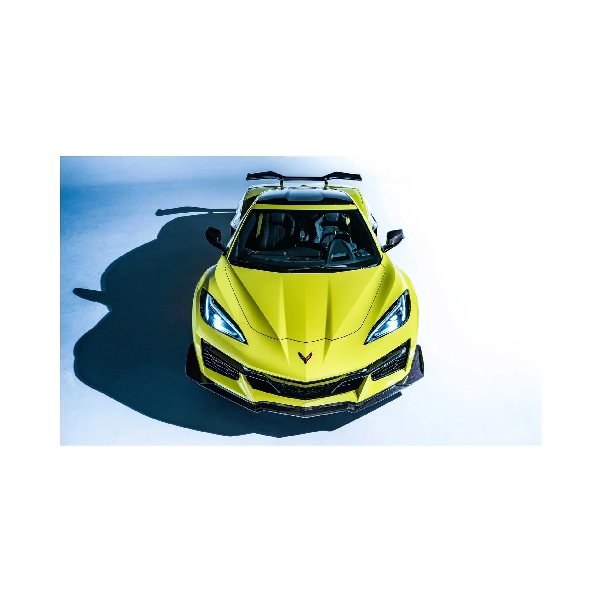 Bright yellow stunt Corvette sportscar front view with aggressive design on white background