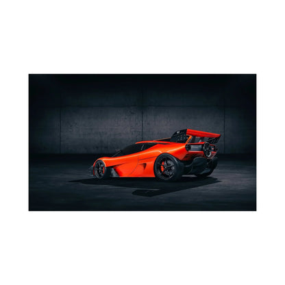 Red McLaren F1 LM hypercar with black rims in dark industrial setting