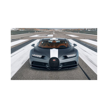 Front view of black Bugatti Chiron with white racing stripe parked on runway