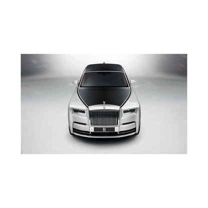 Front view of luxury two-tone Rolls-Royce car with distinctive black hood and silver body